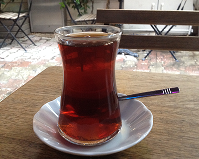 Tea in a glass with a spoon